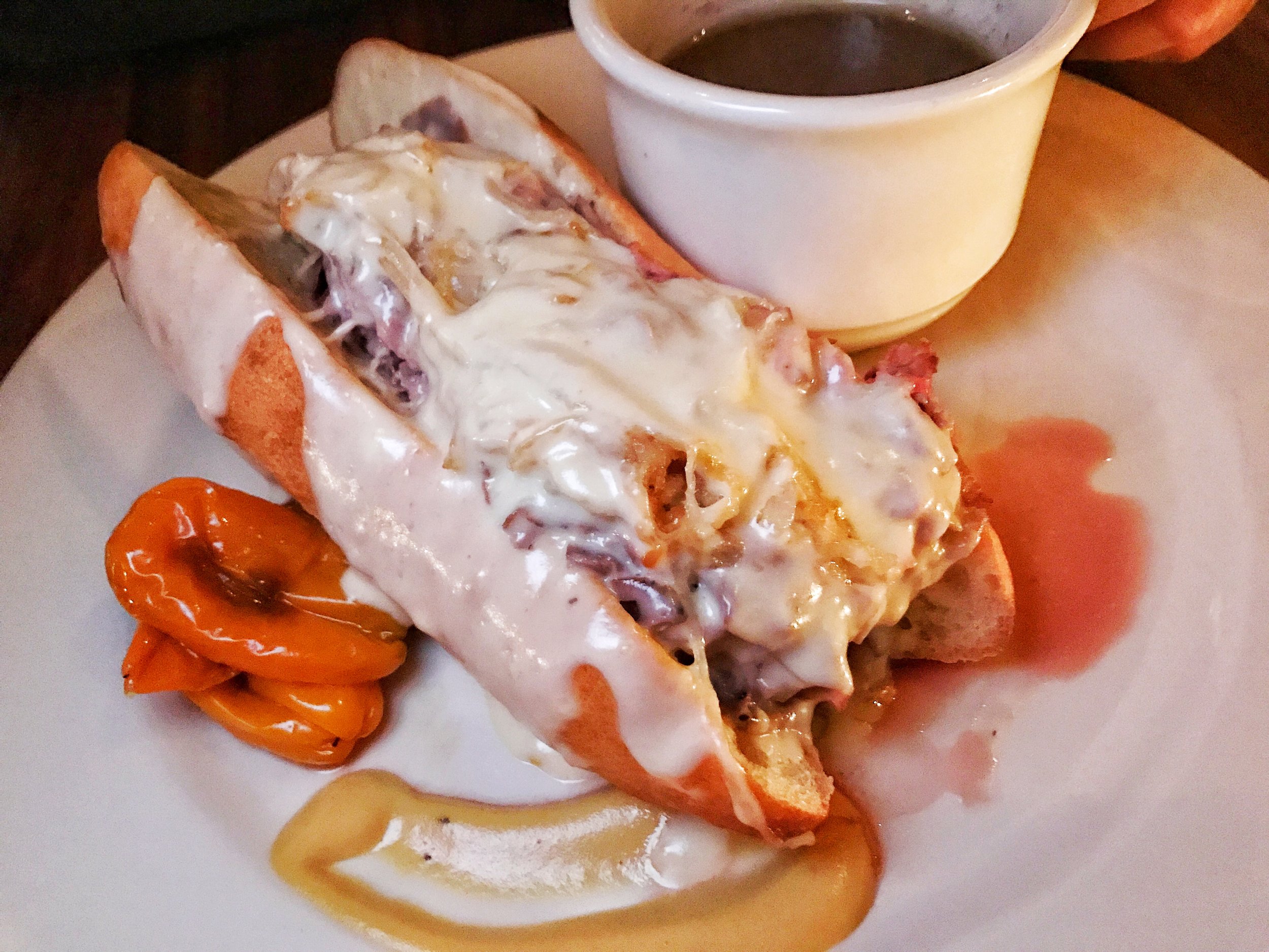 Deluxe French dip with fried onions and gruyere fondue