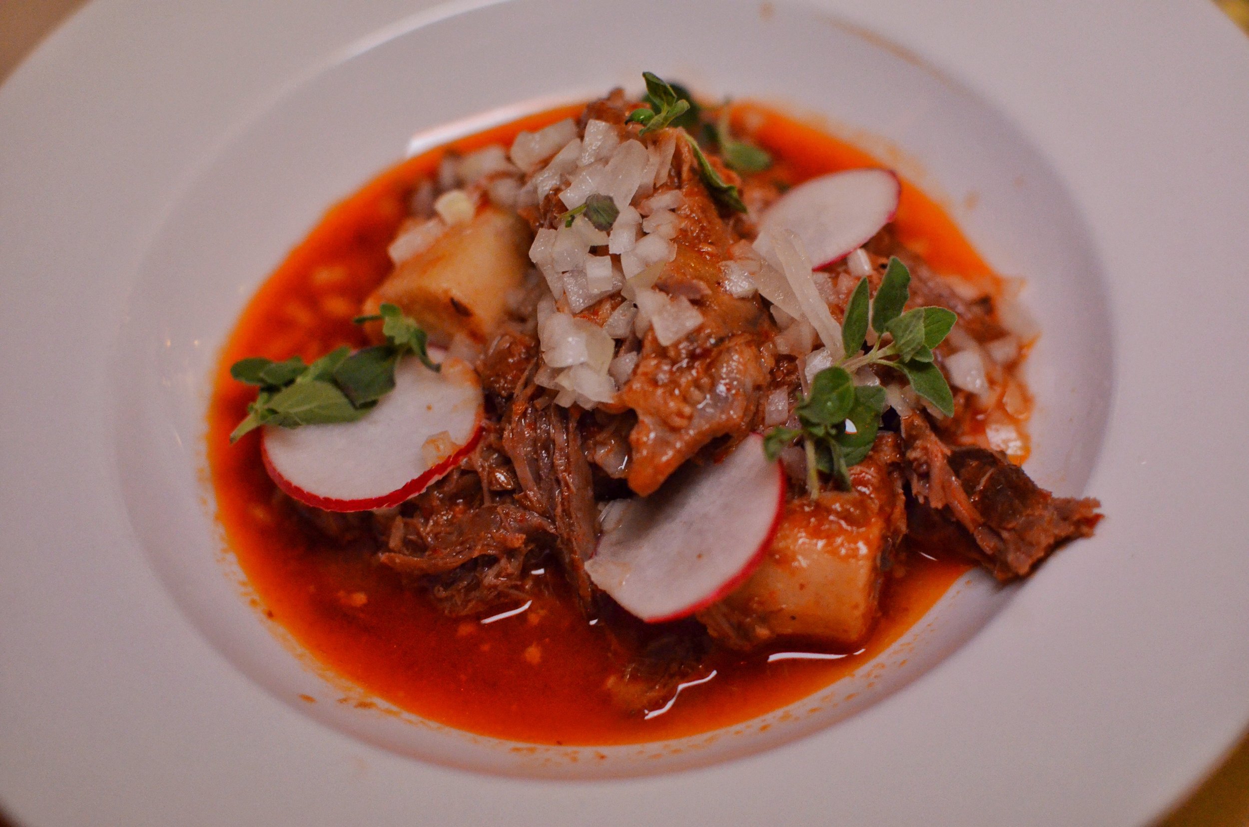 Cumin lamb barbacoa- masa “tamale” gnocchi, raw white onion, oregano.