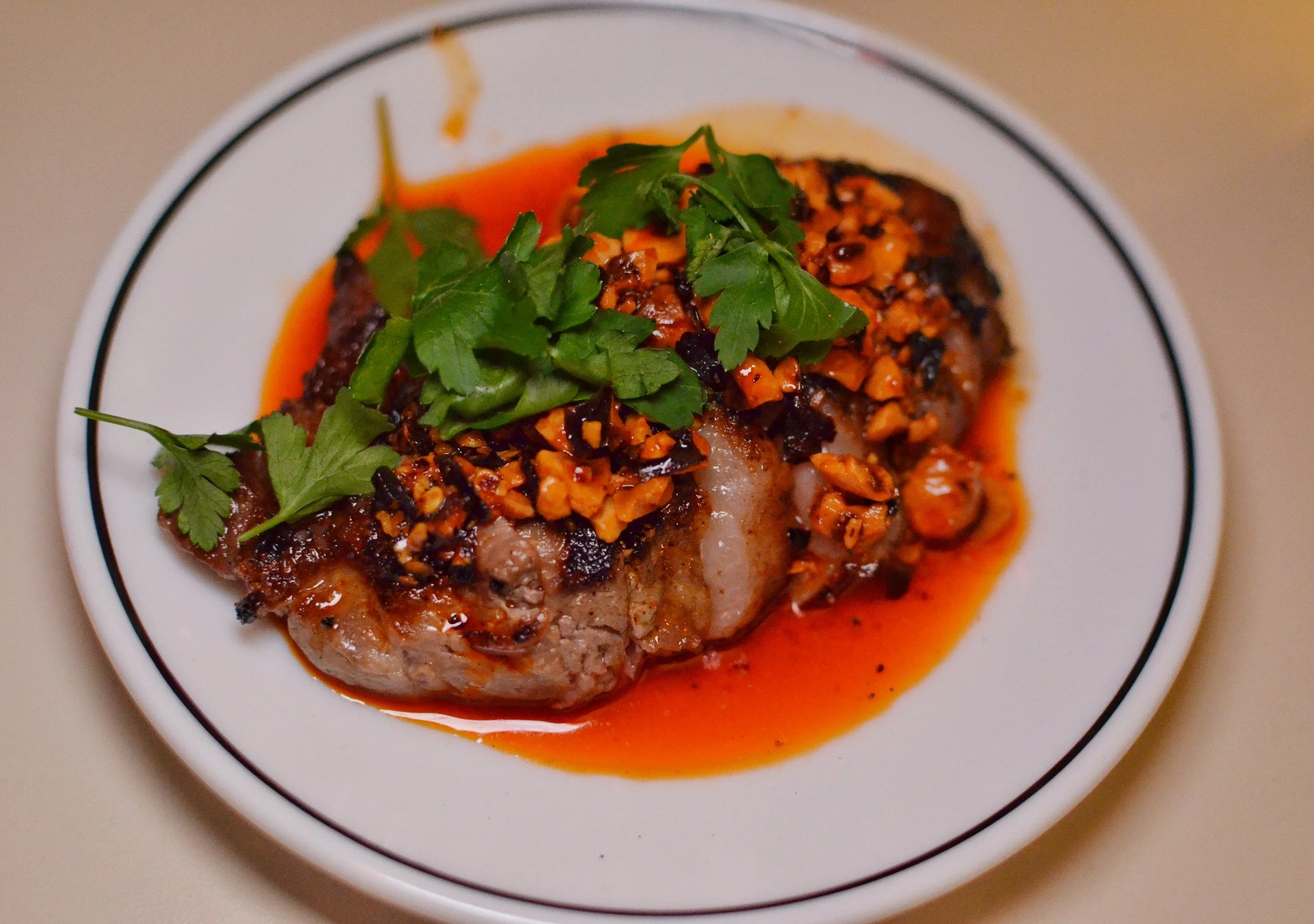 Baby steak- 3.5oz dry aged strip w/ chile-hazelnut oil.