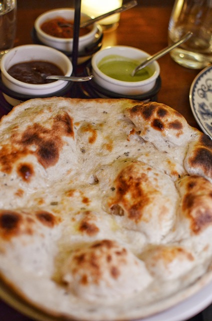 Rosemary naan with sides of tomato kalonji, tamarind, mint-cilantro