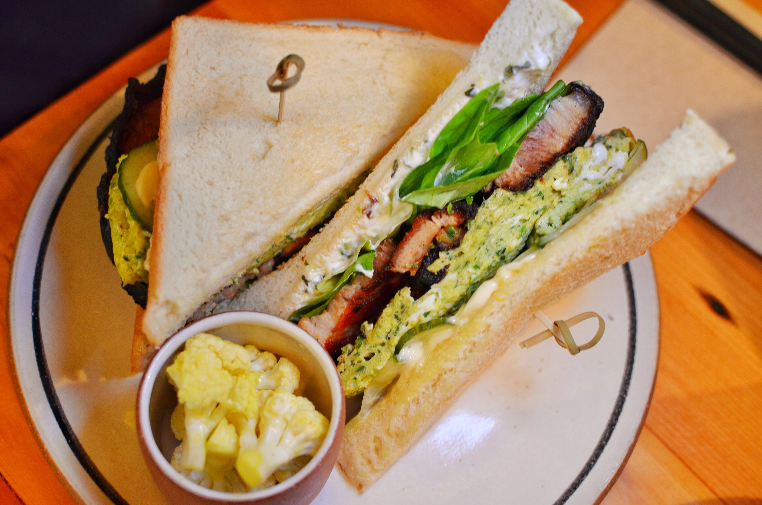 Green eggs and chaashuu sandwich- herbed scrambled eggs, tomato braised Berkshire pork belly, cucumber, kewpie mayo on thick cut milk toast