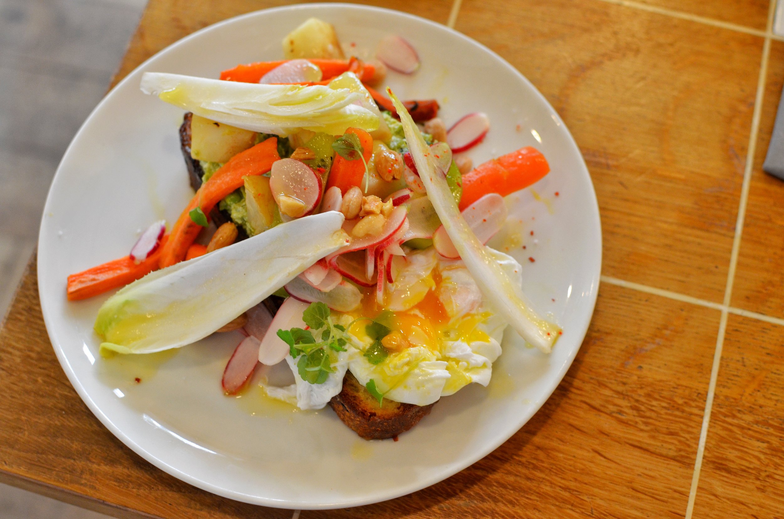 Tartine with poached egg- The tartined is loaded with vegetables and an herb sauce. It's really tasty and filling. 