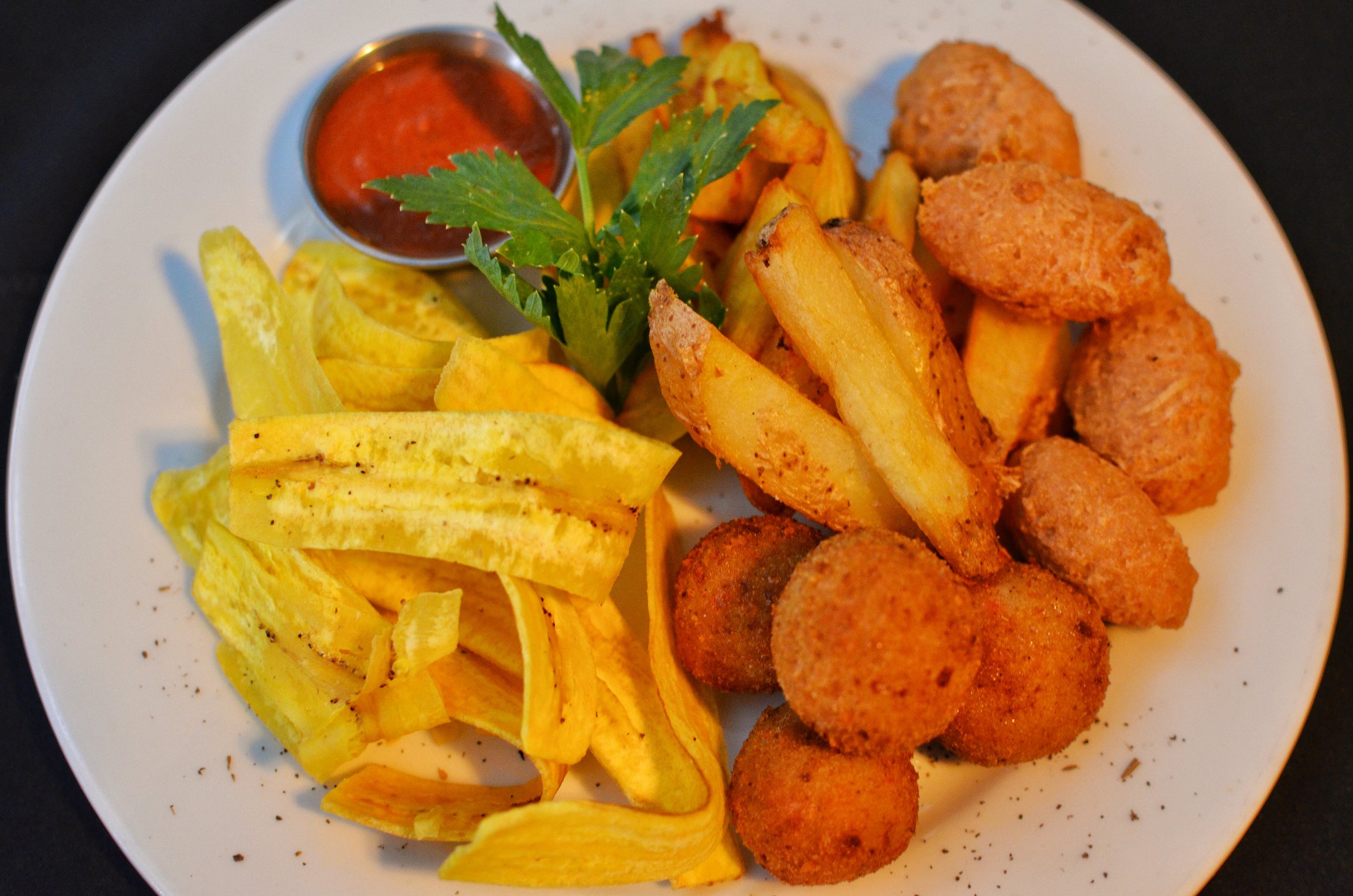 Appetizers included fried balls with taro, yuca fries, plantain chips