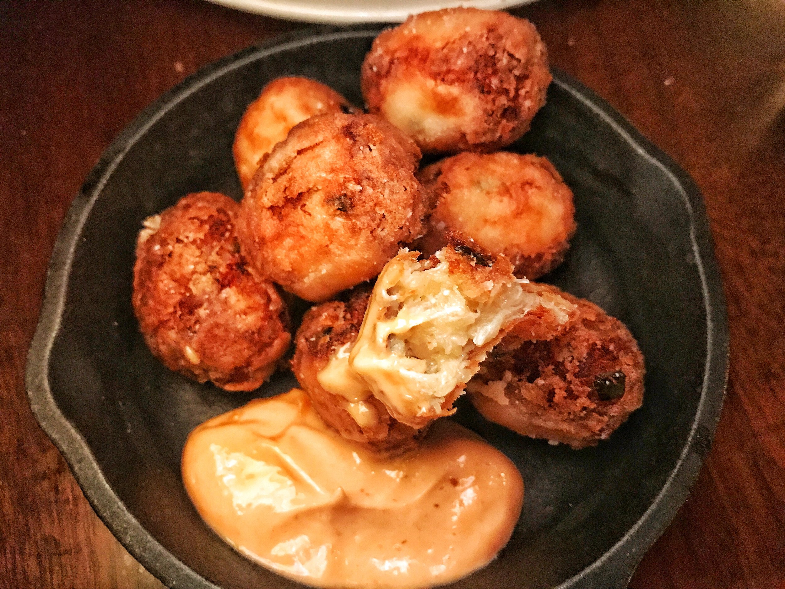 Dungeness Crab Tater Tots with smoked chili aioli, shaved chive