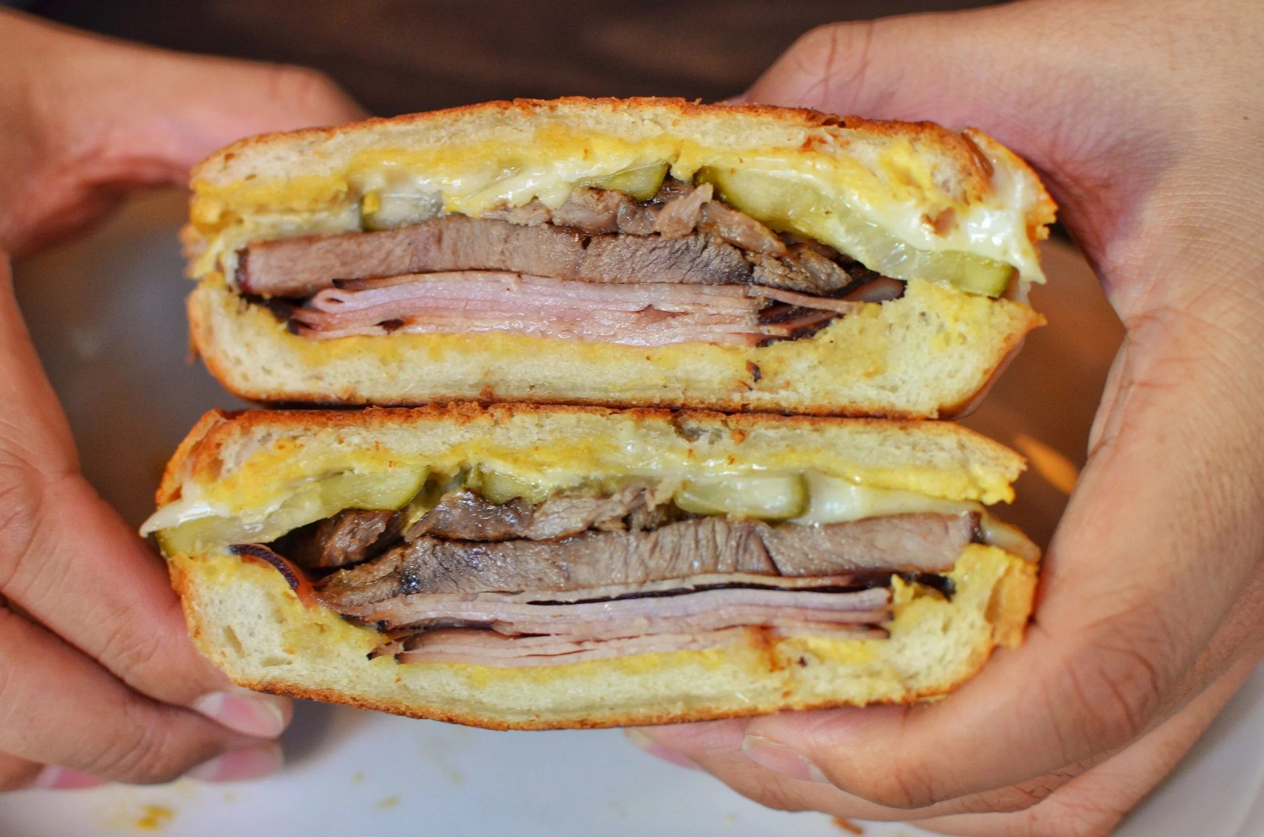 Cubano with roast pork, shaved ham, swiss cheese, pickles