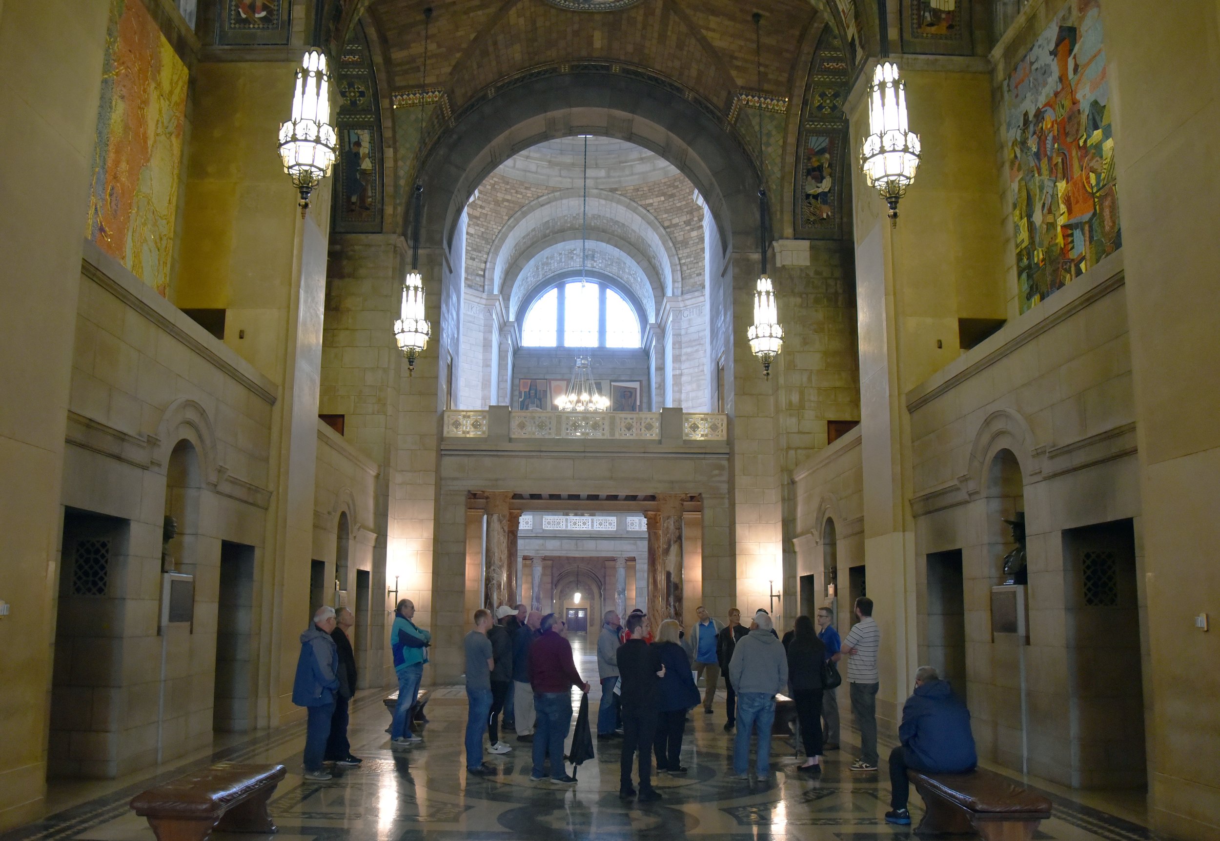  The PAL tour group soaks in the grandeur of the Capitol entrance corridor while hearing about the HVAC project from Paul Bauman, Project Manager with Alvine Engineering. 