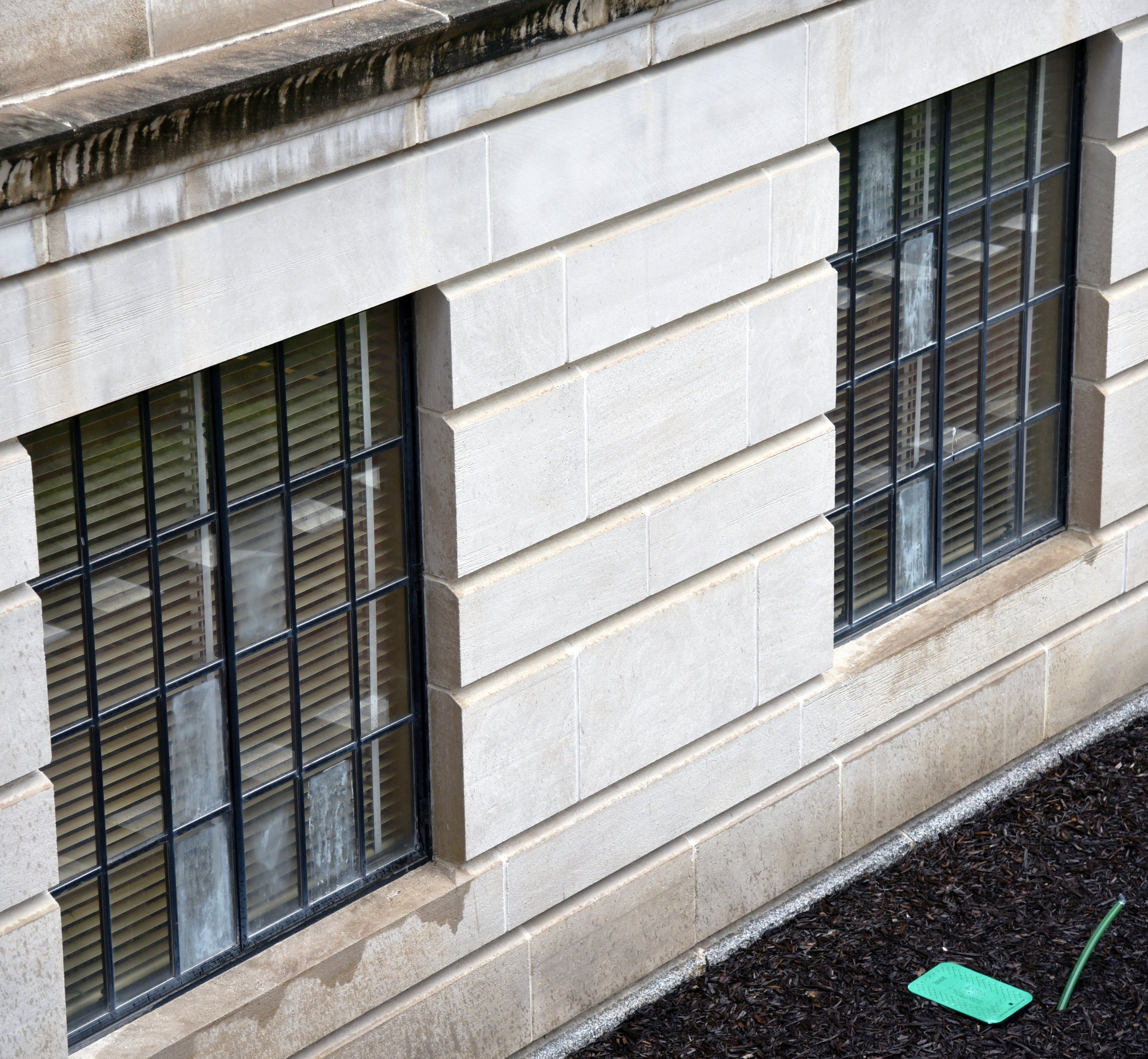  Due to numerous failed thermopane glass seals, as seen here on windows in a Capitol courtyard, the original window frames are being carefully restored, weather-sealed, and refurbished with single-pane glass. 