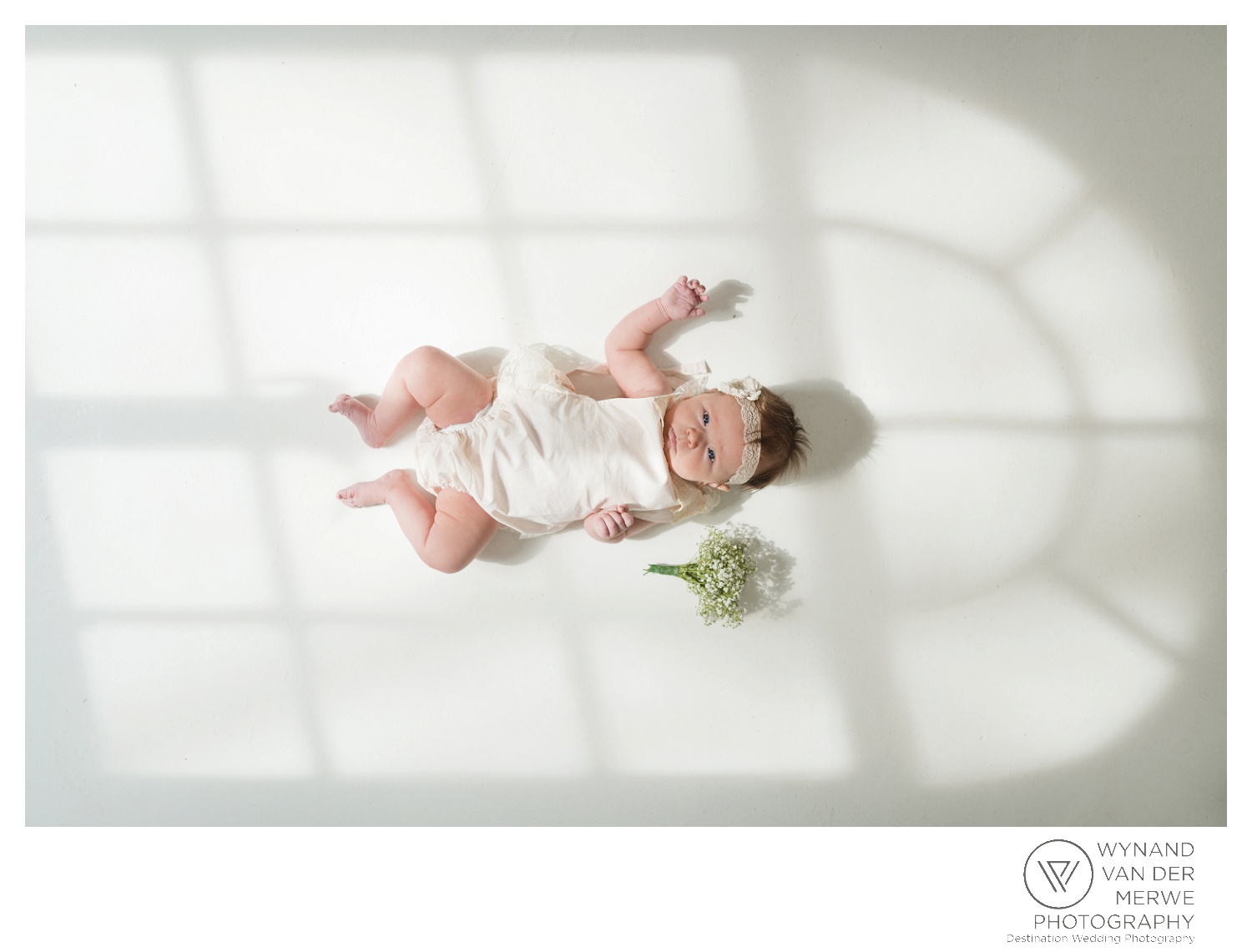 A little girl in her mom's wedding dress