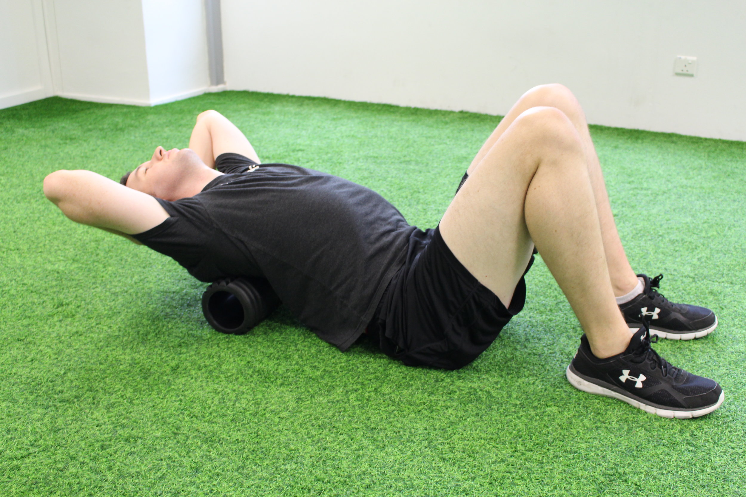 Using a foam roller between the shoulder blades, mobilise the upper back by extending over the foam roller. Hold for two deep breathes and relax. Repeat eight repetitions.