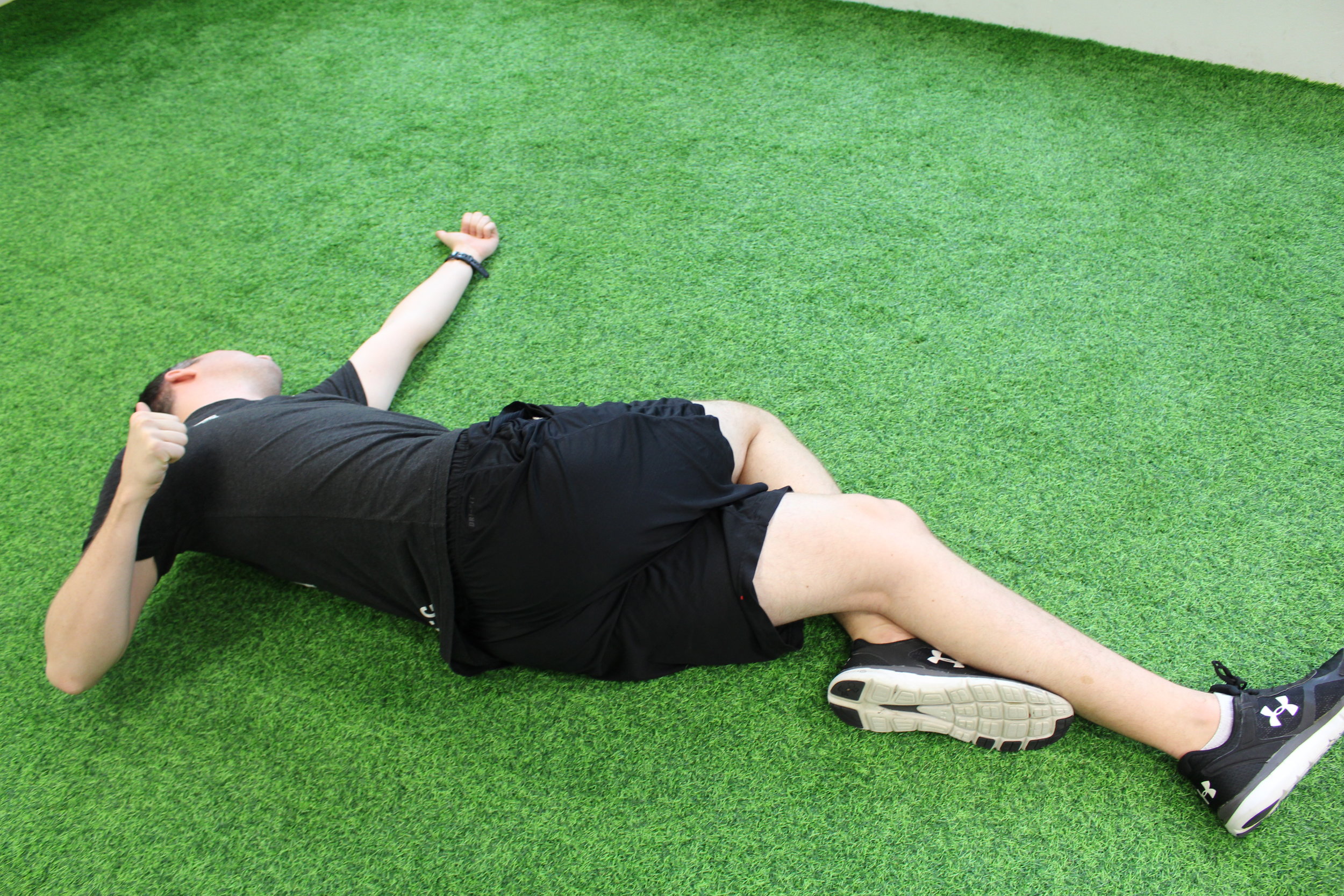 Performing a bow and arrow movement. Open the chest for ten repetitions. You should feel the stretch in your shoulder, chest and mid back.