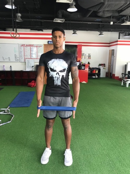 2. Stretch the resistance band by bringing your hands in-line with your shoulders.