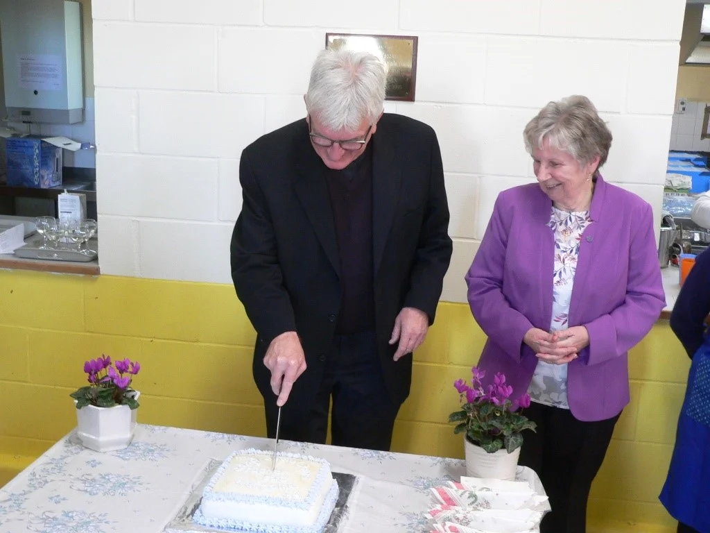 Fr P Cutting Cake.jpg