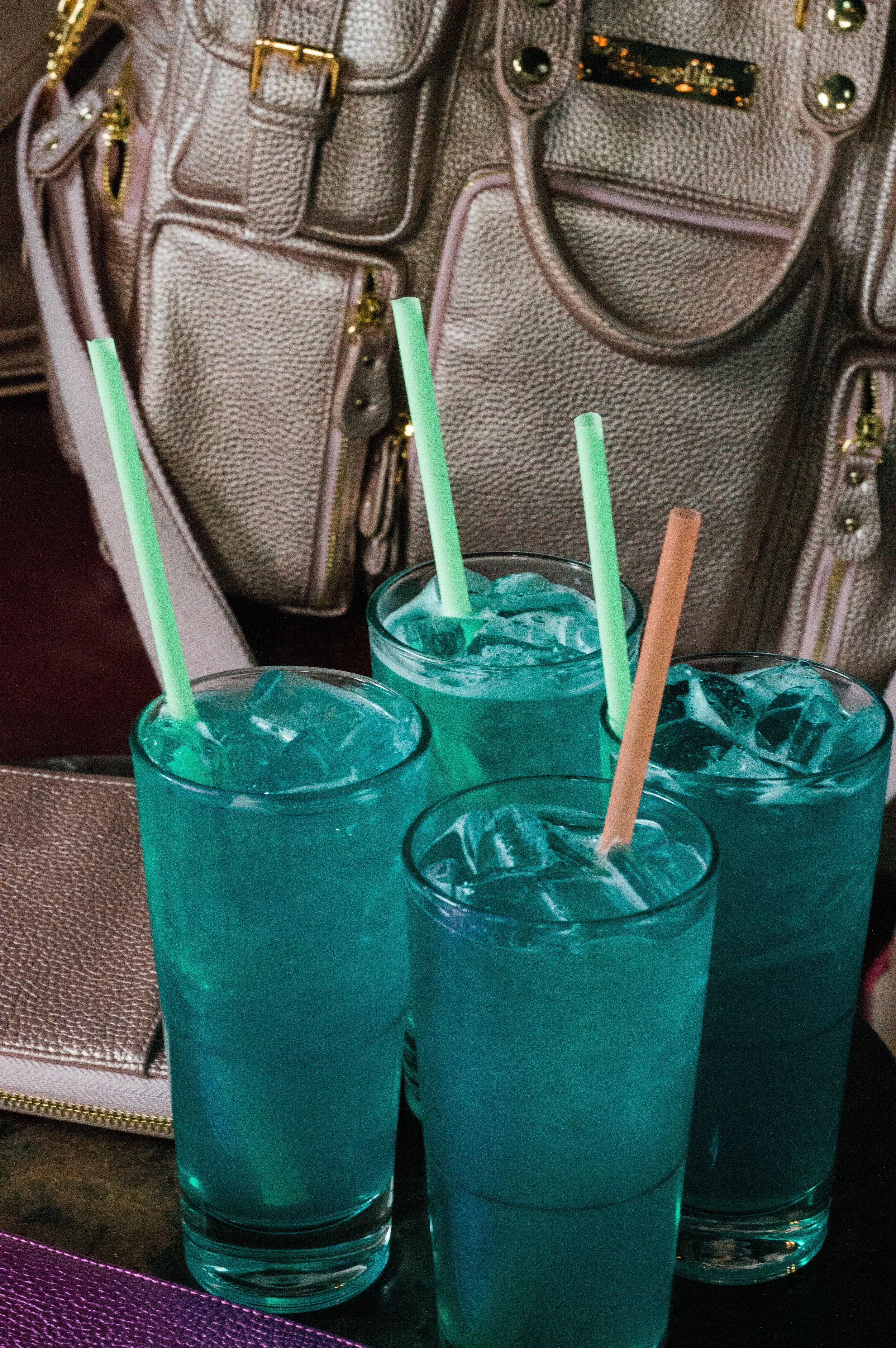 The perfect mermaid style drink, featuring the HOF Travelers Wallets and Evermore.