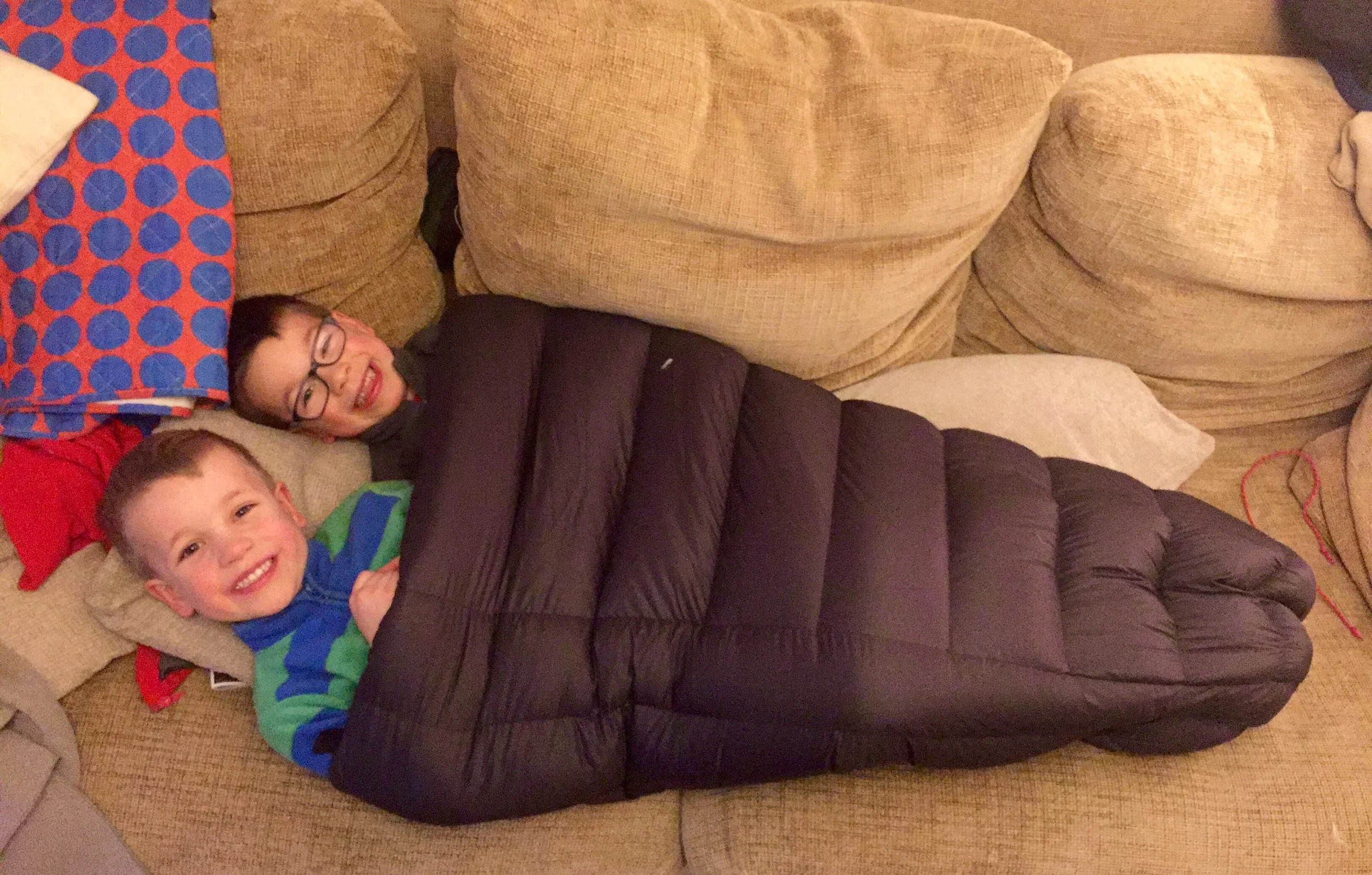 Two boys in 0.5 of a sleeping bag