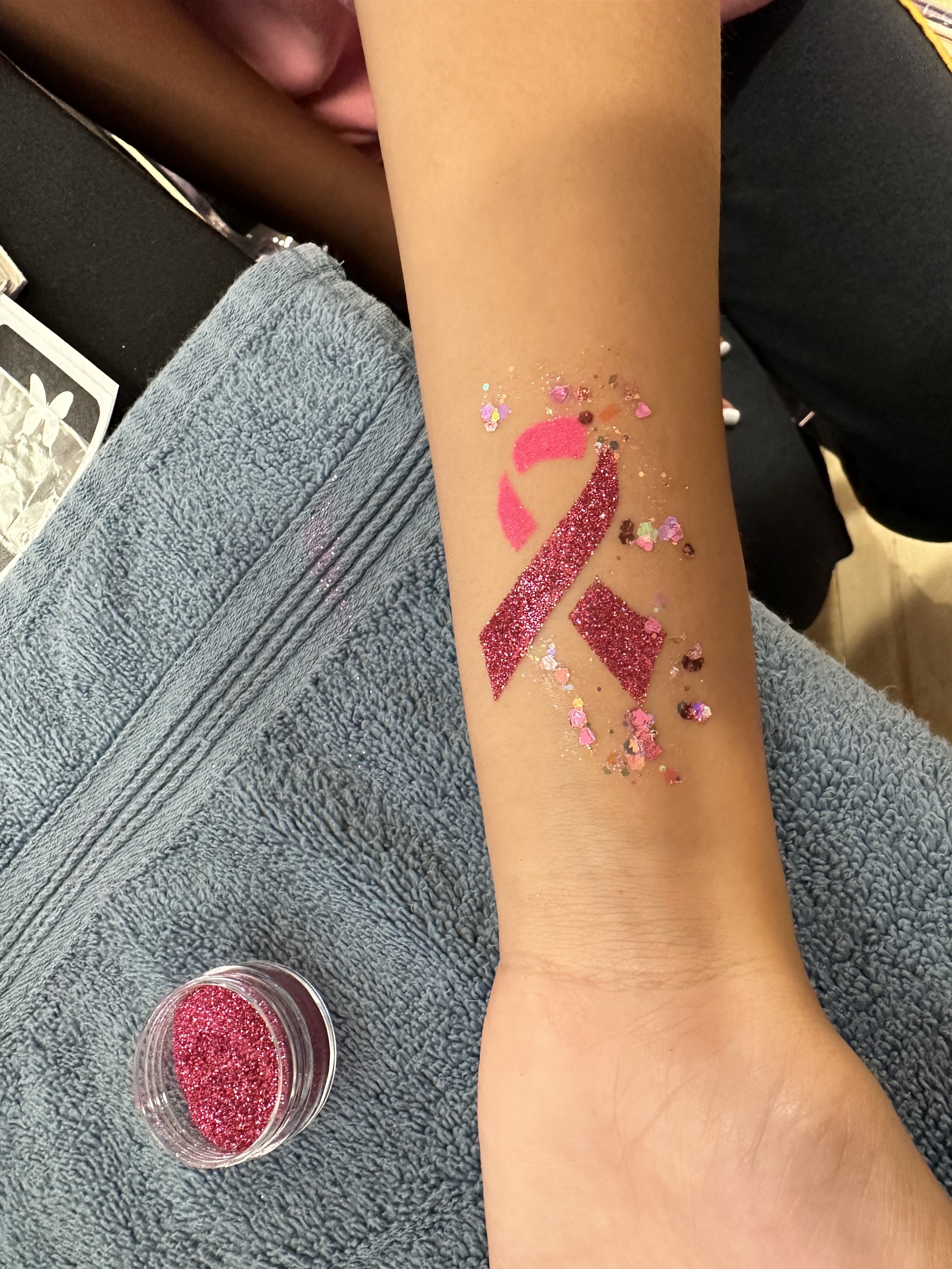 Glitter Tattoo Artist for Breast Cancer Awareness Event NYC.jpg