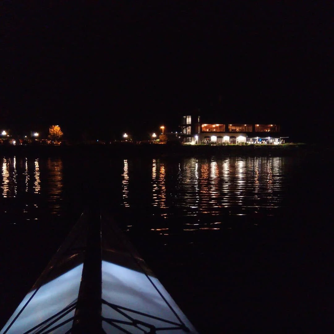 Lights out in the sky,  lights on in the boat. 
We found a break in the rain and waited for the tide to calm down just enough to run to our car, fold up our boats and get in the water to see some fireworks that I didn't manage to photograph but seein