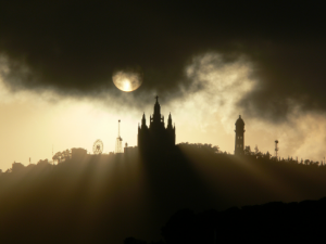 Sun going down behind the Tibidabo in Barcelona