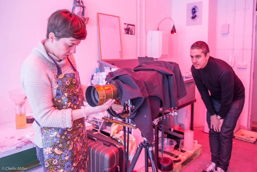 Almudena Romero making collodion plates at her studio in East London for her project "Growing Concerns" about immigrants to UK. With JC Candanedo (Grey Pistachio).