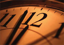 analog clock about to strike 12:00