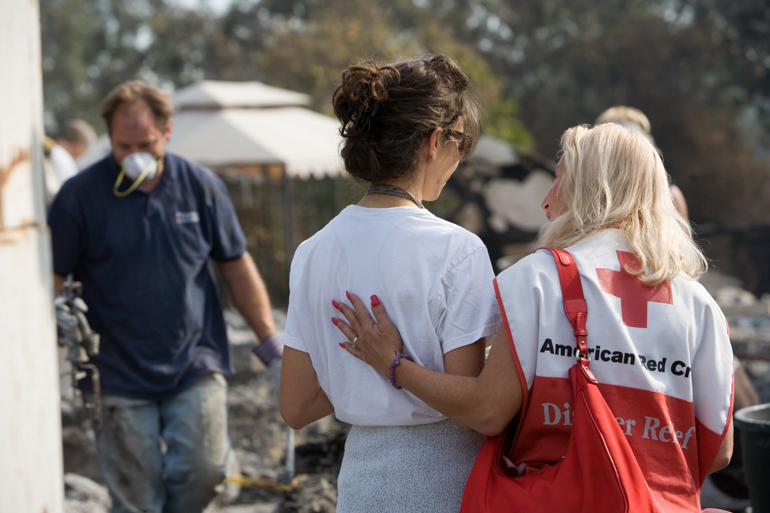 American RedCross member caring for home fire survivor