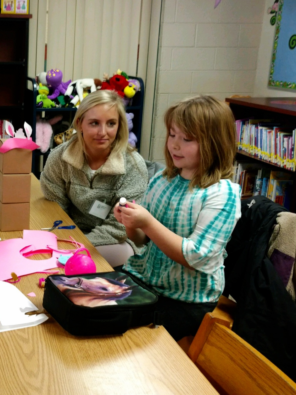 Big Brothers Big Sisters working on art with Mary McGuire students