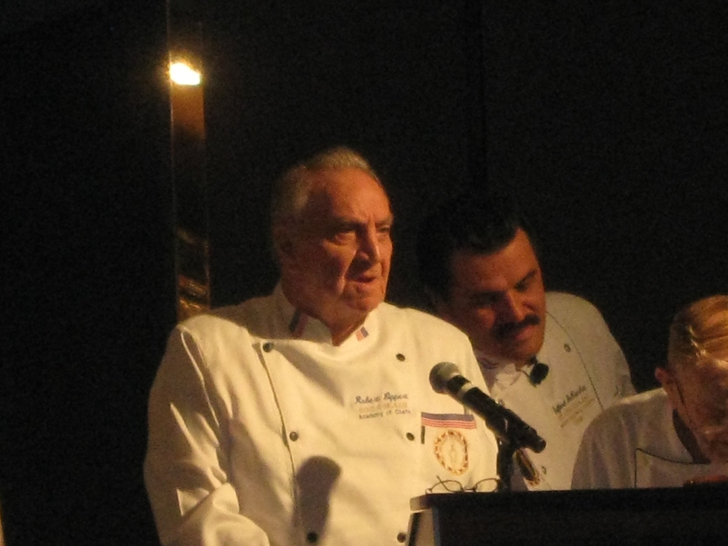 Bob speaks at a podium
