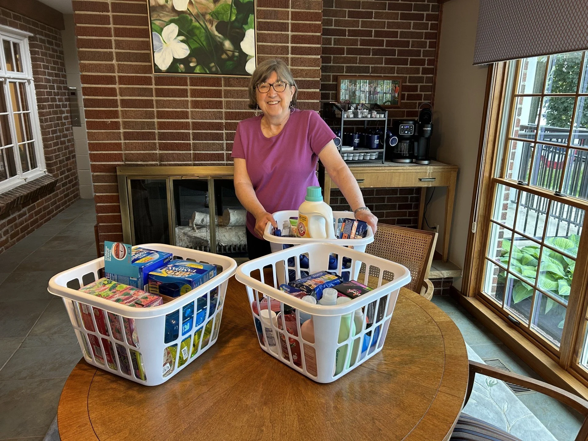 Picture of Mary Anne Zang from Zonta Club of Mt. Pleasant dropping off donations for Kay's Way.
