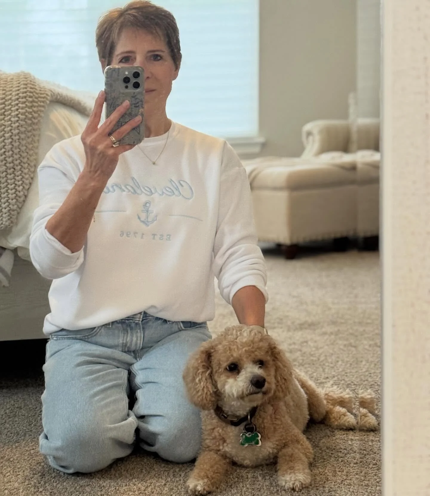 I'm absolutely loving my new cozy Cleveland sweatshirt from @lakesidelocalsapparel! Stop by and get yours today, we are open 11-6!! 🛍️😊 Baker loves it too!! 🐶💕