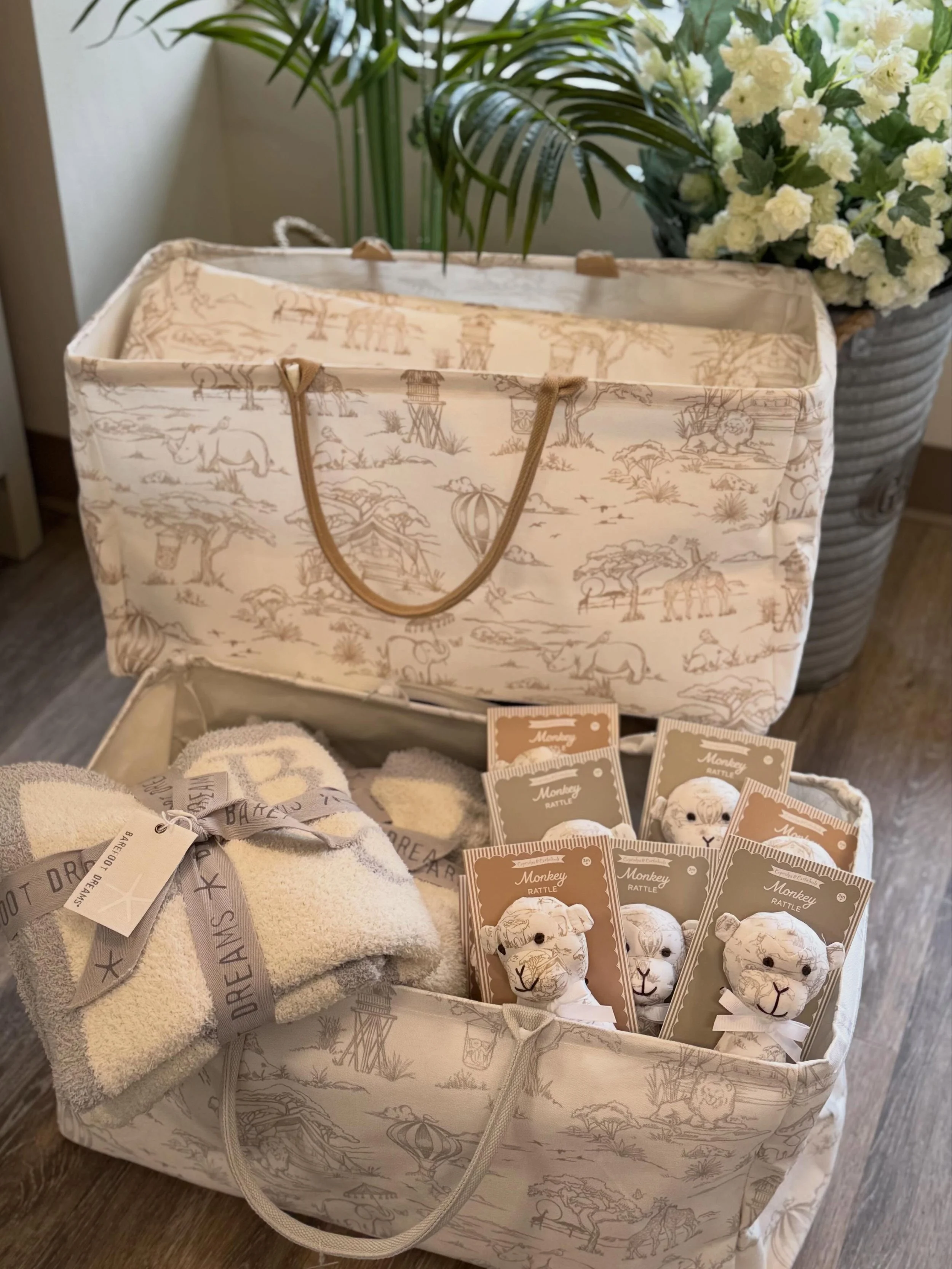 This Sweet Safari hamper tote is perfect for holding little toys, cozy blankets, or baby laundry, &amp; when paired with the adorable monkey rattle it becomes a delightful gift for both Mom &amp; Baby.