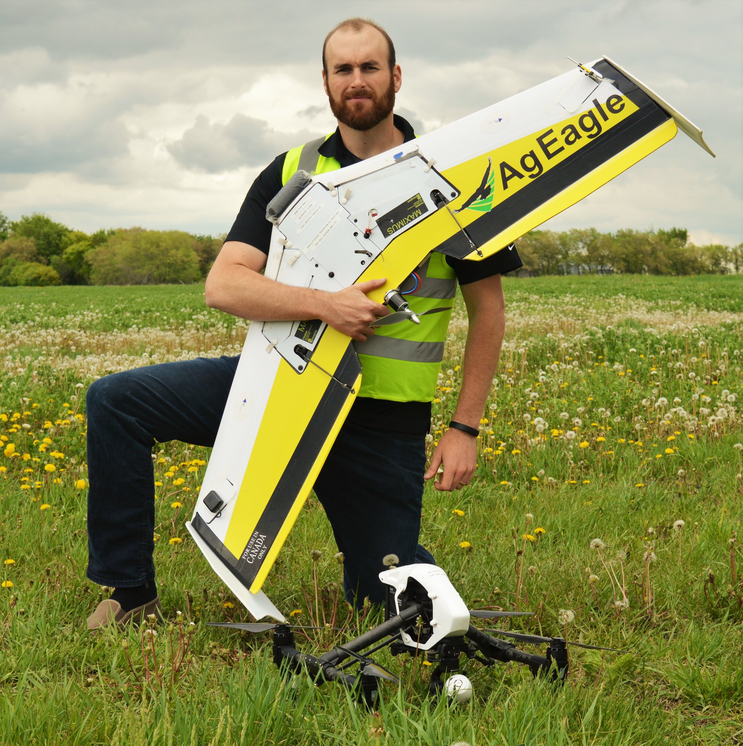 M3 Aerial Productions CEO Matthew Johnson poses with the AgEagle Rx60 near an alfalfa field in New Bothwell, Manitoba. Imagery was gathered as part of a study in conjunction with the Manitoba Forage and Grassland Association's Green Gold Program.