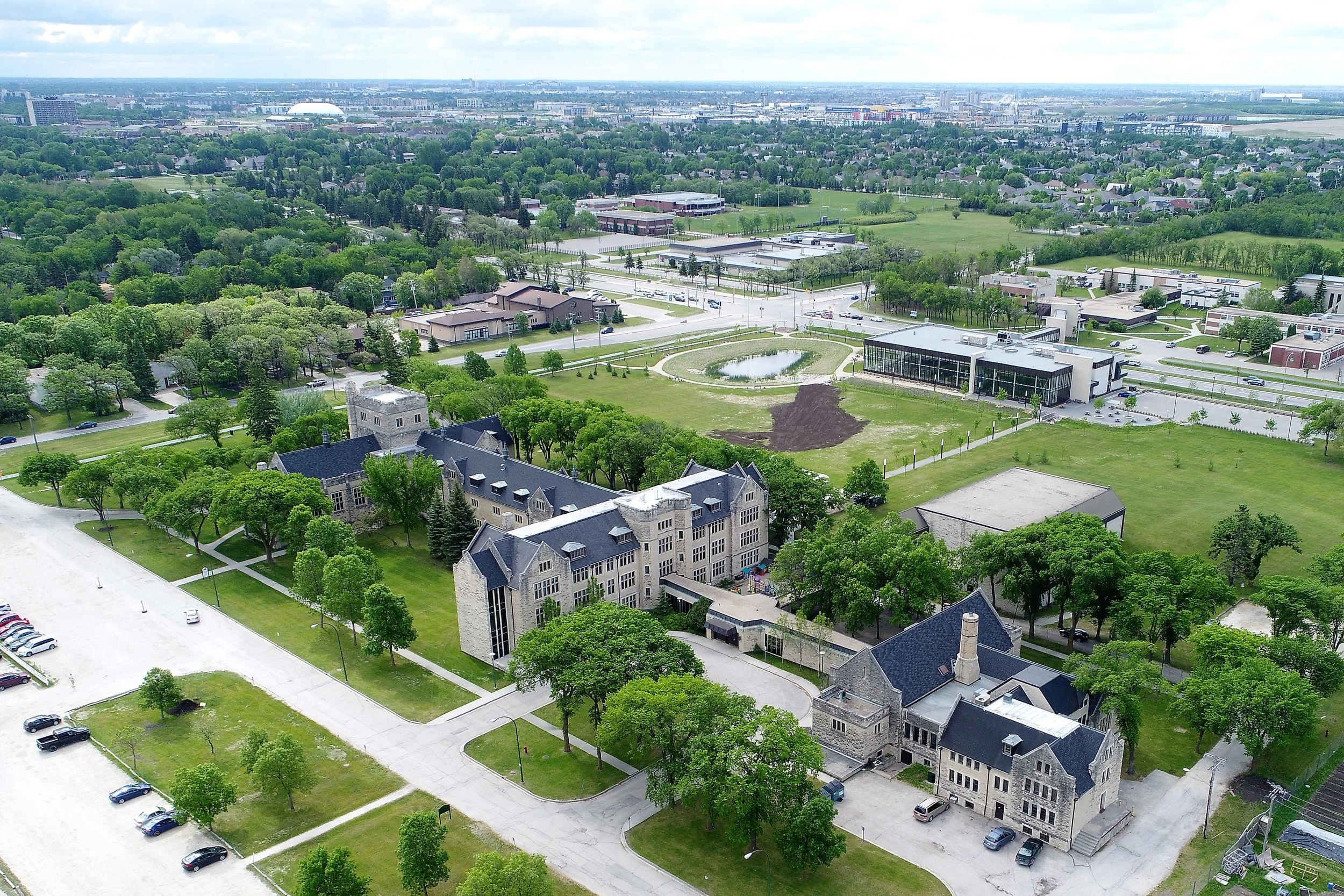 In order for Drone pilots to operate within cities or "built-up areas," they must have in place a complete set of operating procedures to maximize safety and minimize risk. This image of the Canadian Mennonite University was taken at the 2017 Crohn's & Colitis Canada Gutsy Walk. M3 Aerial Productions had a crew onside of 9 people, who were responsible for ensuring proper distances from the UAV to the public were maintained at all time, as well as to alert people of the operation, in case of an urgent situation.