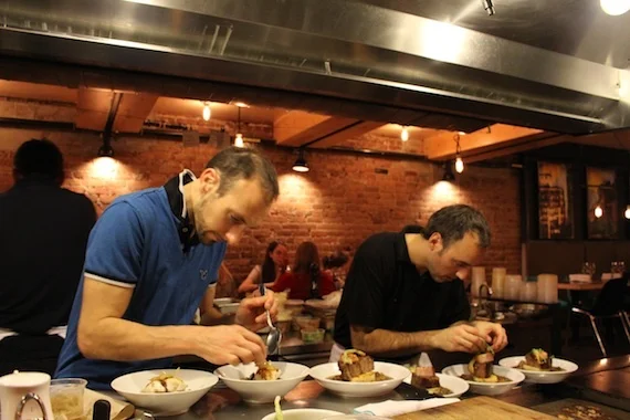 Chefs in the open kitchen at La Fabrique Bistrot , Montréal