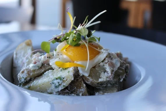 Potato salad with kale, bacon and soft boiled egg at Bota Bota Spa , Montréal