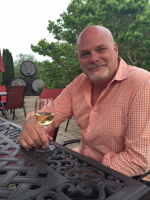 Jeff Hundertmark, head winemaker at Stoney Ridge and Mike Weir wineries, sips a glass of Ahead by a Century.