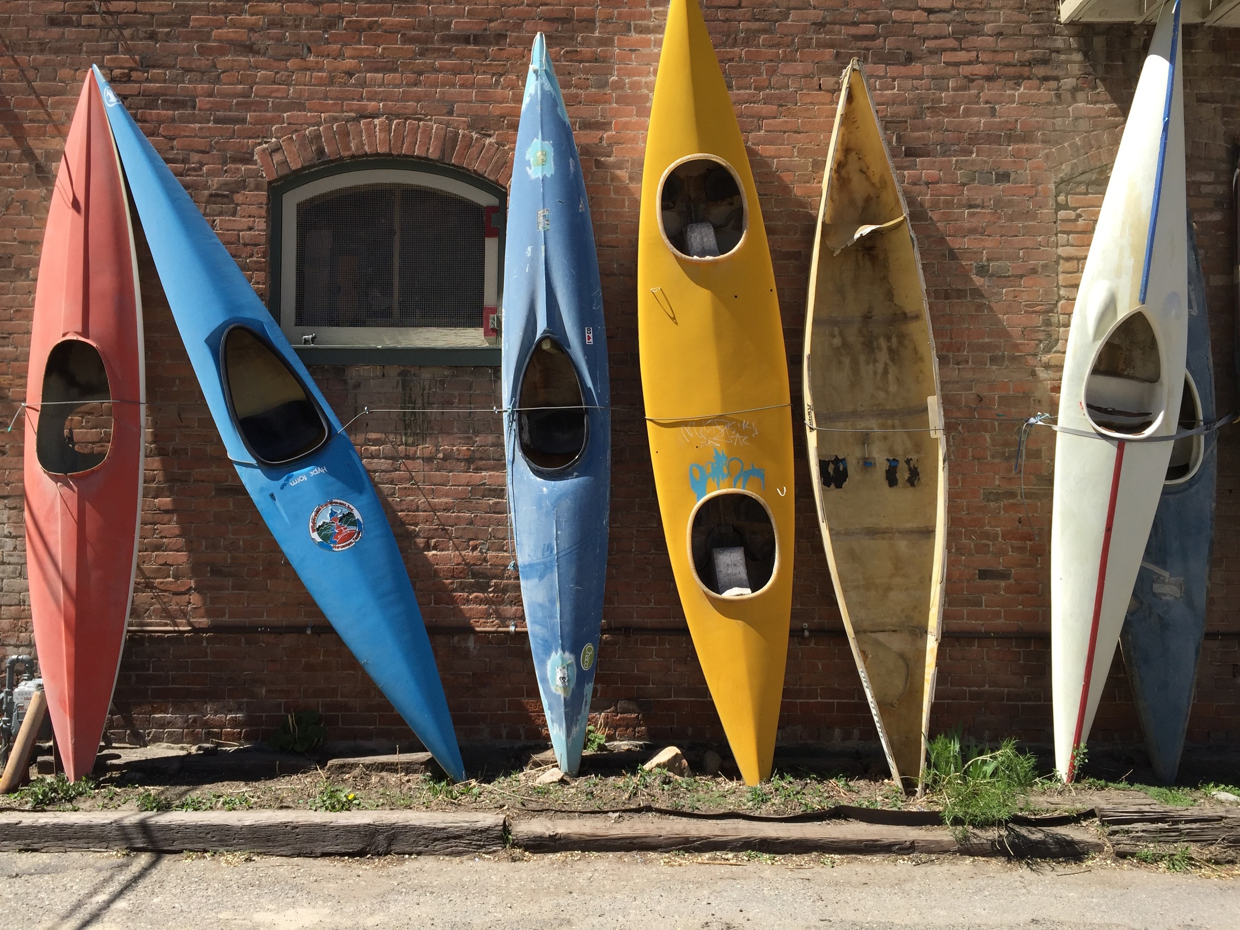 50 year-old kayaks line what is reputed to be the most photographed wall in town.