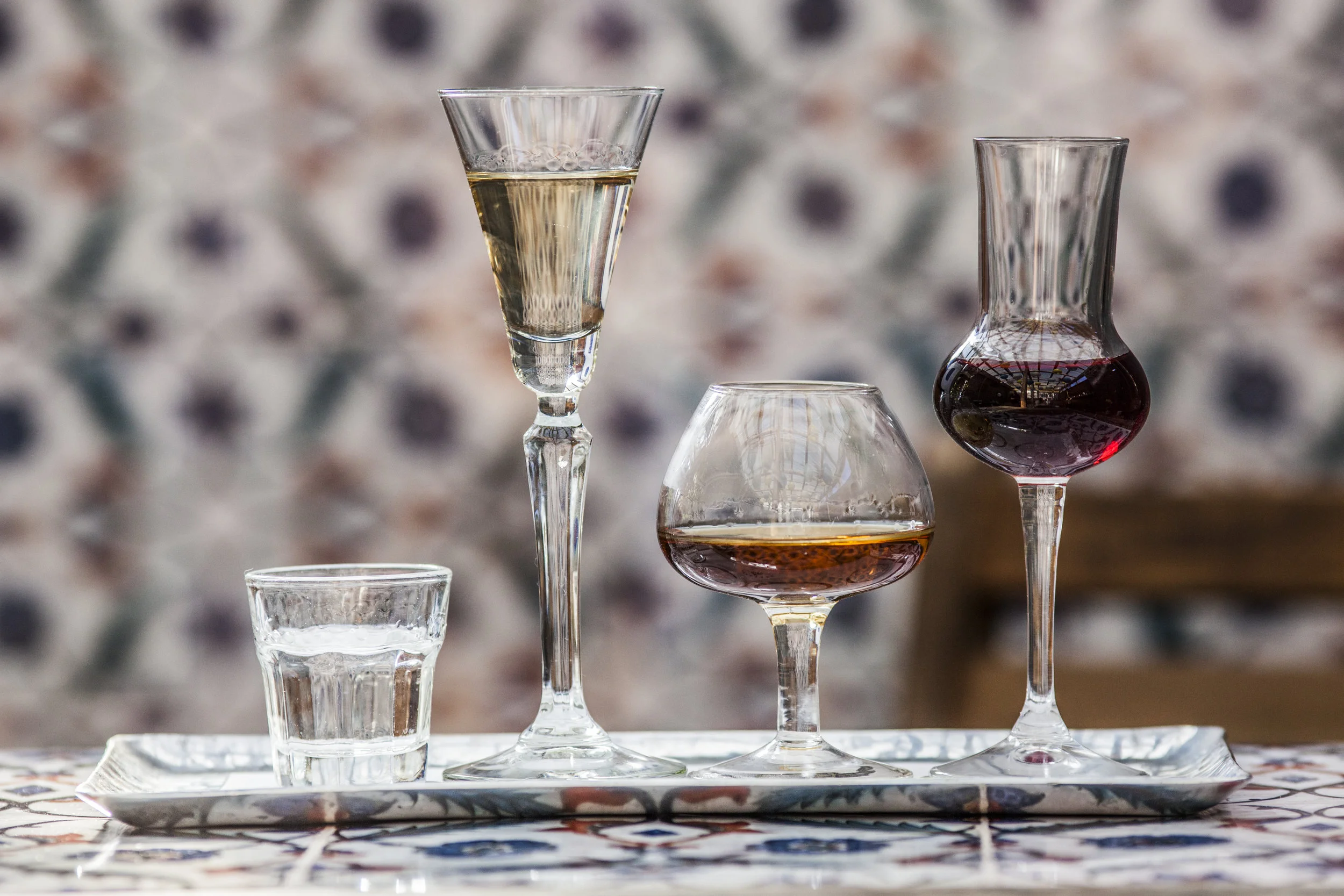 A fabulous tequila tasting includes a blanco, reposado, anejo, and in this case, a pomegranate-infused tequila. Photo courtesy of Joe Fuda.