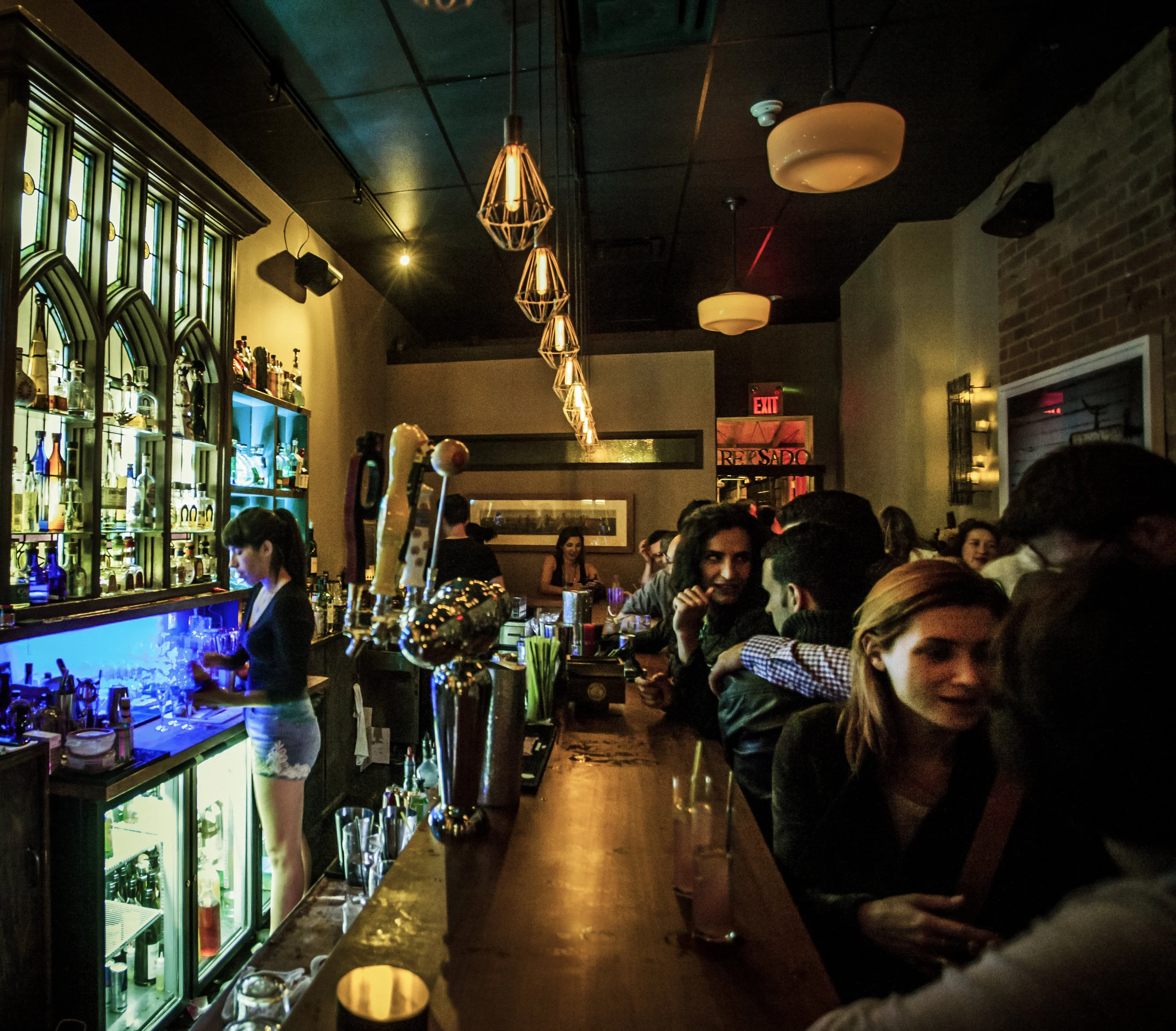 At Reposado, dim lights, live music and a rustic decor create the perfect ambience for sipping tequila. Photo courtesy of Joe Fuda.