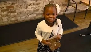 Student Highlight: Jhaloni Stamper portrays Ruby Bridges as students read about civil rights icon