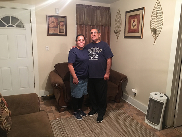 Margarita Rodriguez and her husband at their new home on Fabius Street. The Stand staff photo.