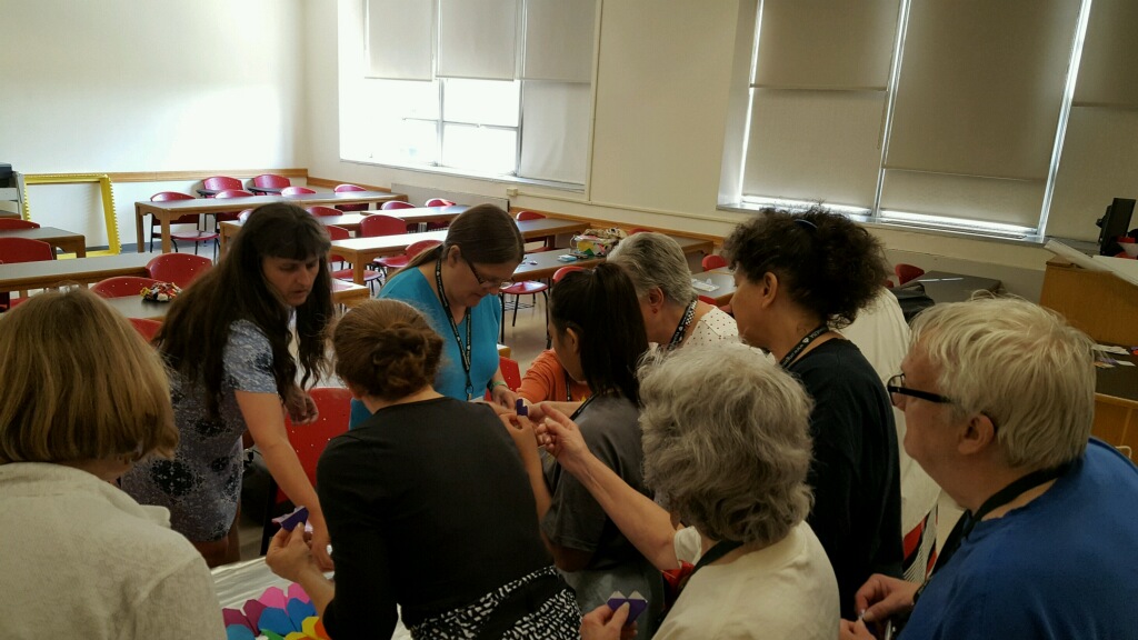 Class at Origami USA 2016 contributing individual hearts for a class banner.