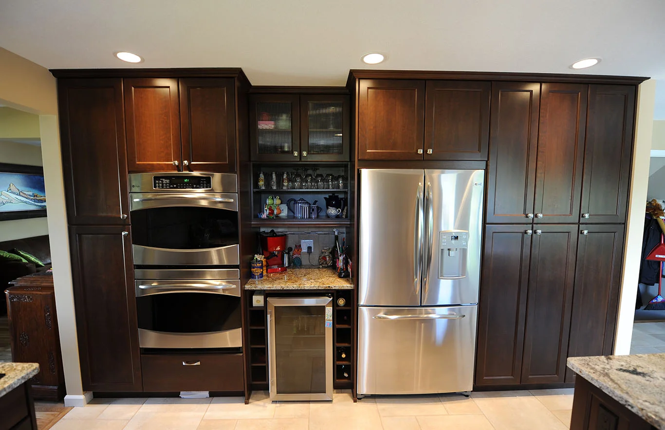 Large pantry storage with built in bar and wall ovens