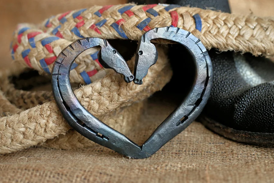 Kissing horseshoe heart forged by hand from re-purposed horseshoes. Size varies as each in one-of-a-kind.