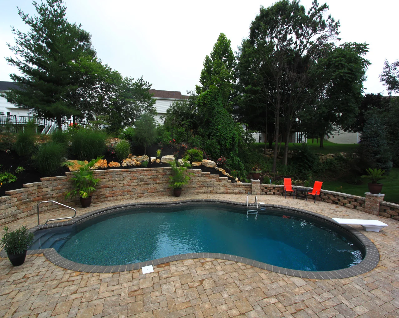 49 | Custom Gemini. Paver Patio, Versa Loc Wall