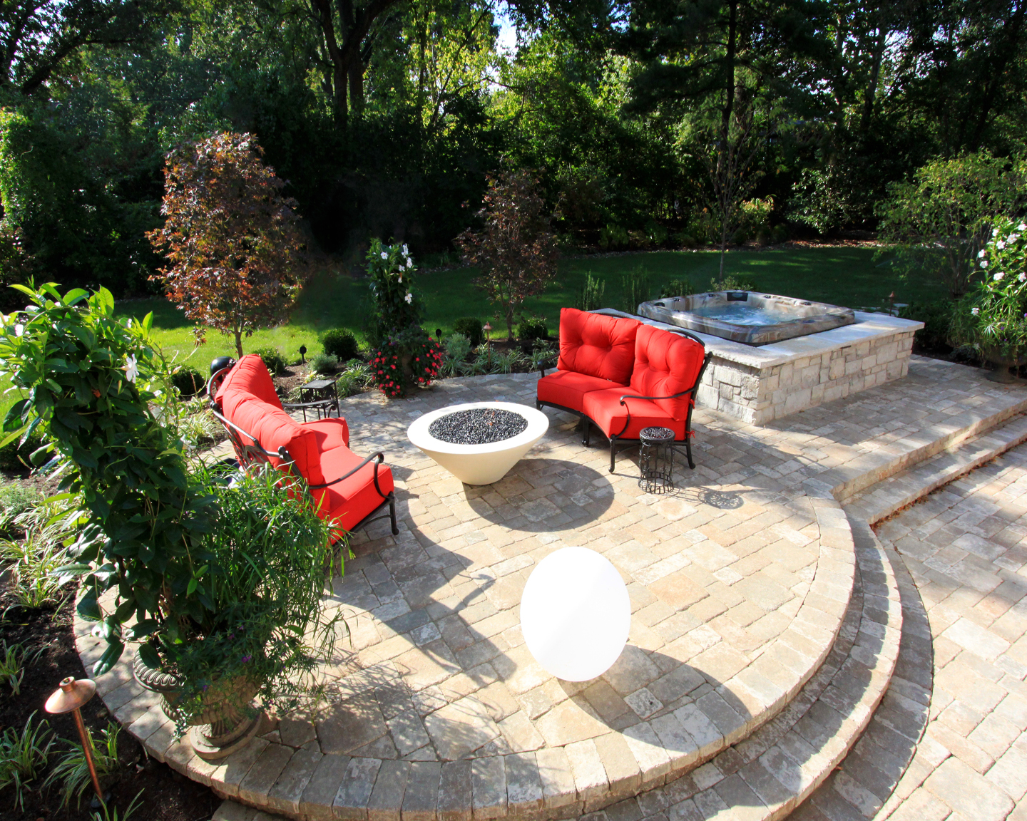 How about entertaining with a fire pit, lush green space and a hot tub in your backyard?