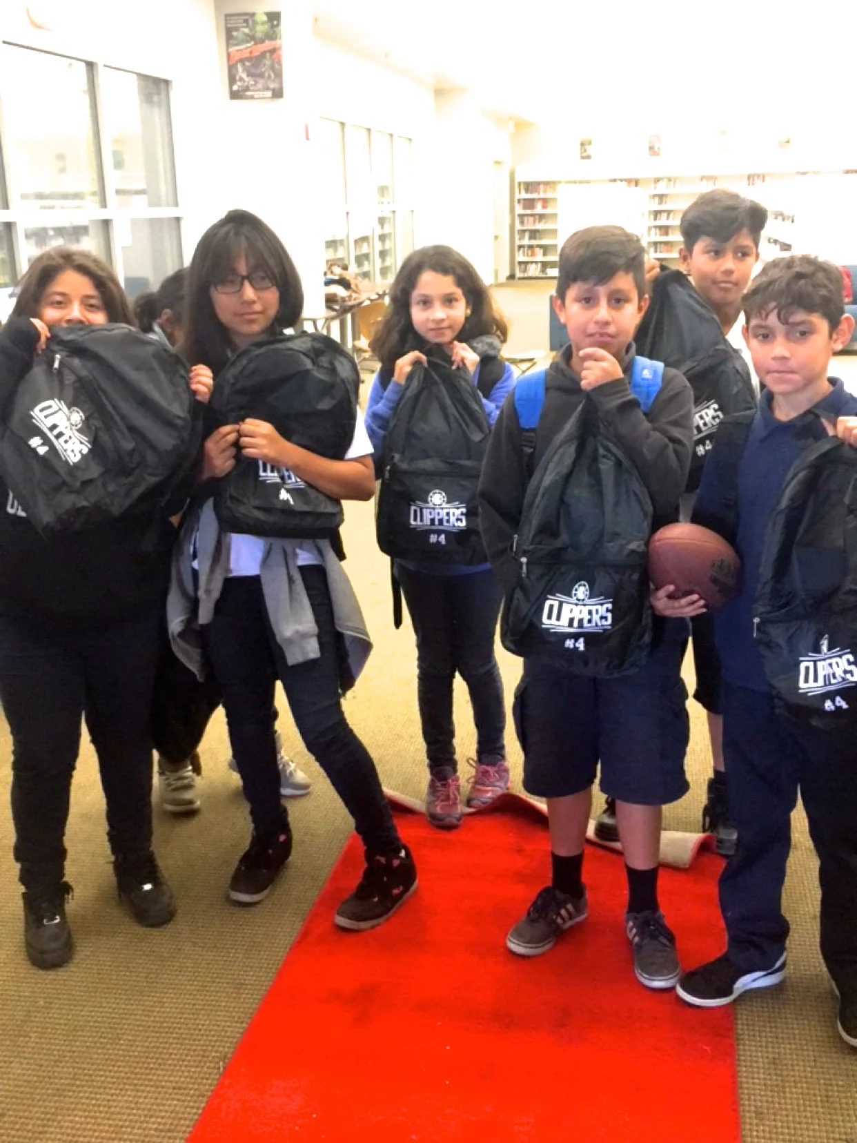 Edison Middle School students with their new LA Clippers backpacks!