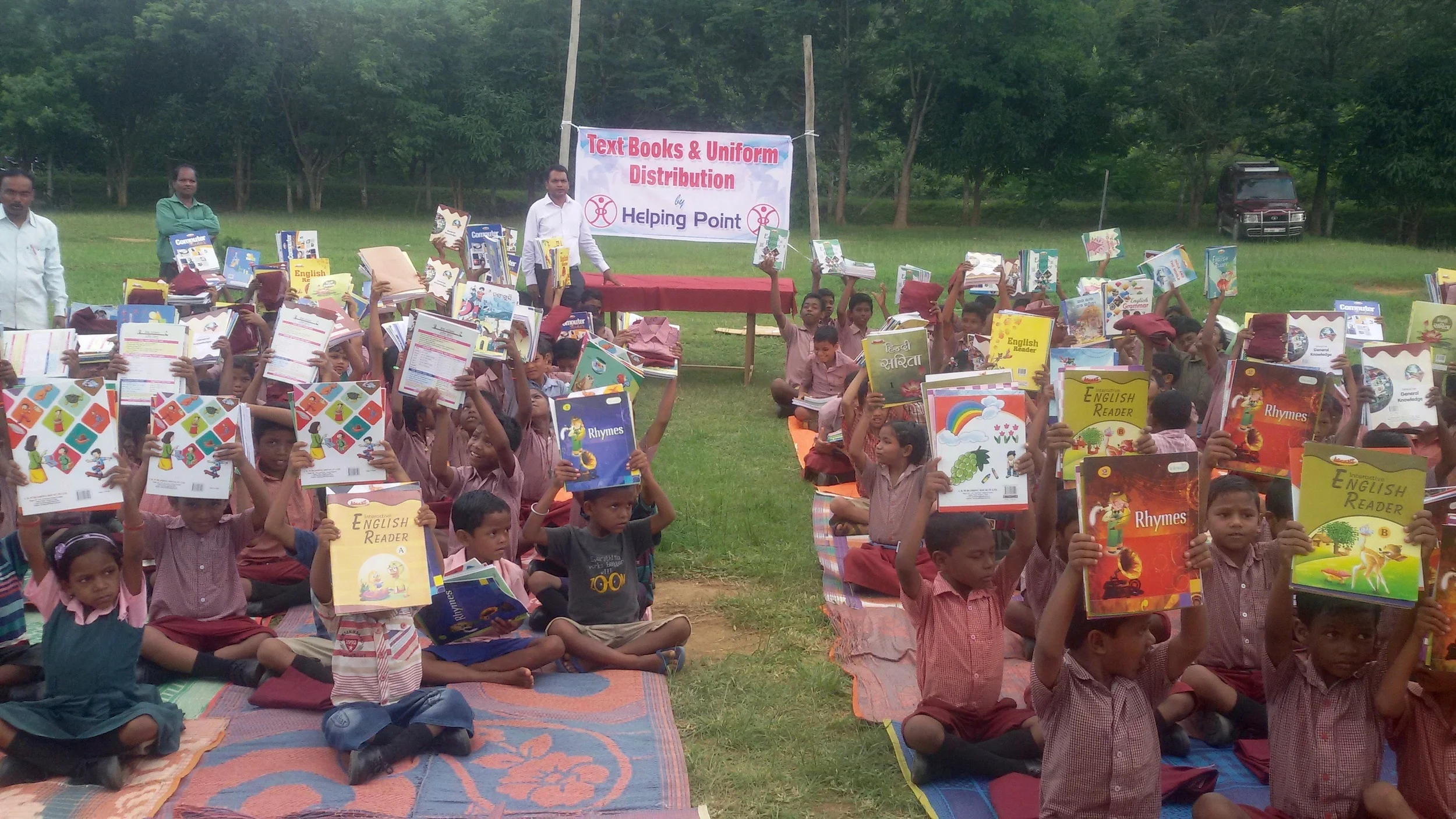 St. Simon's students receiving textbooks and uniforms for the new school year