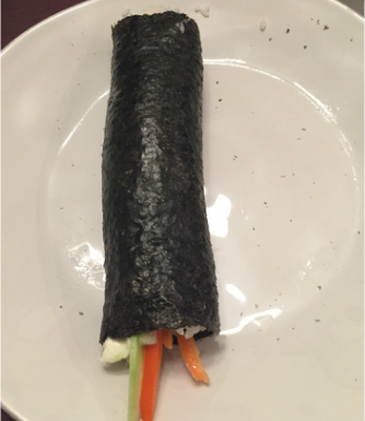 Roll the seaweed up to make a little sushi roll!