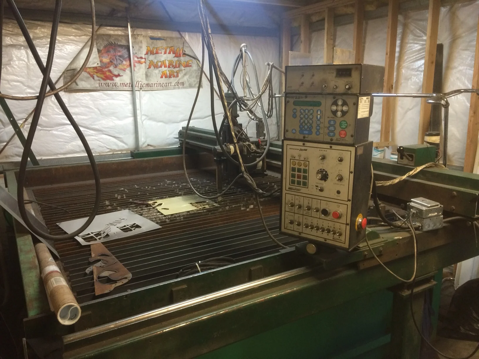 This is the CNC plasma cutter. I just repowered it with a Hypertherm Powermax 85, so it'll do 1- 1/4" steel on a 6' x 8' table. I don't really use it for art because I want things to remain handmade, but its great for making letters and reproducing logos. It came from my buddy Scott at Metal Magic in Kenai.