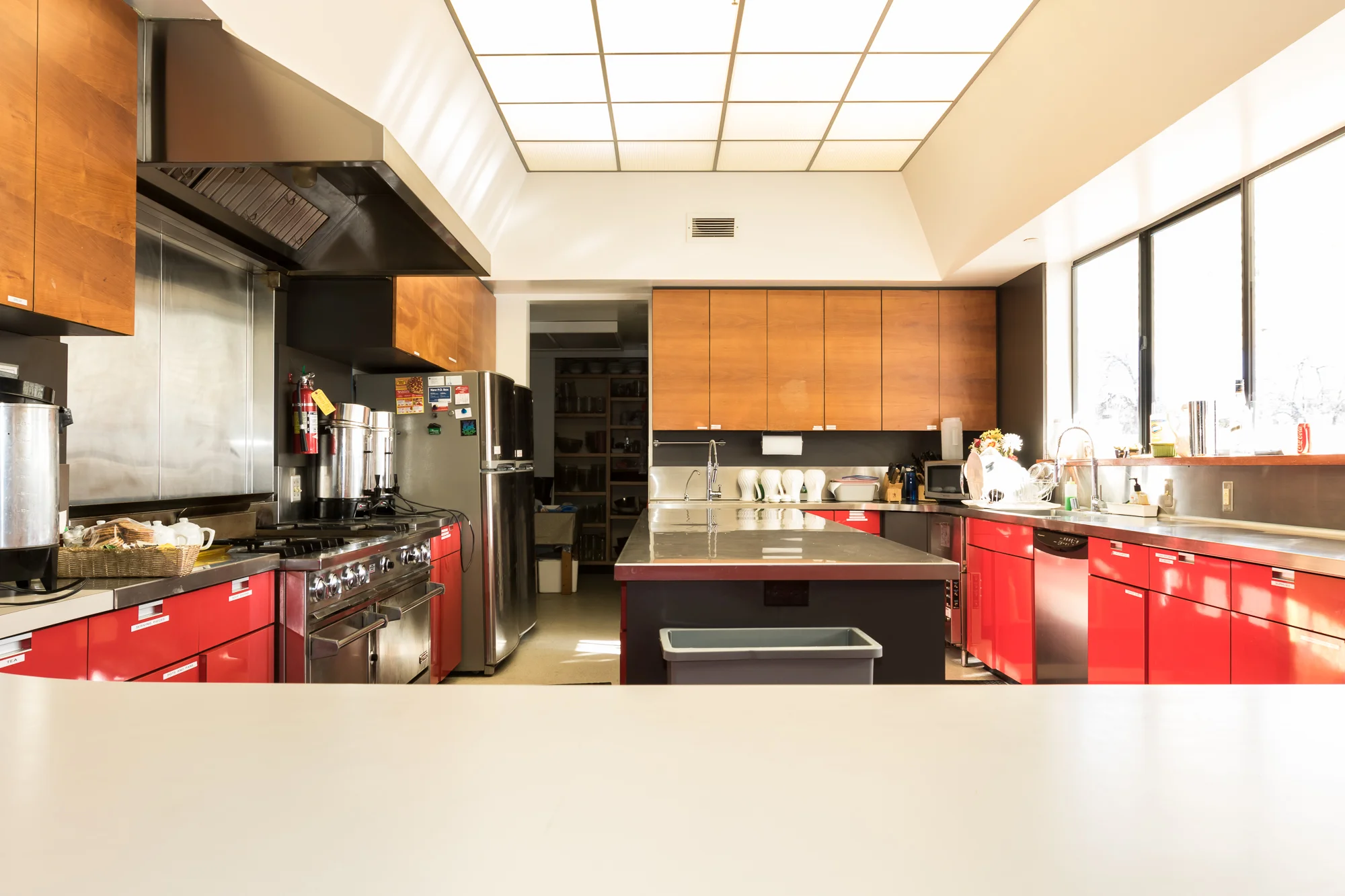 The kitchen from the banquet hall seeing window.