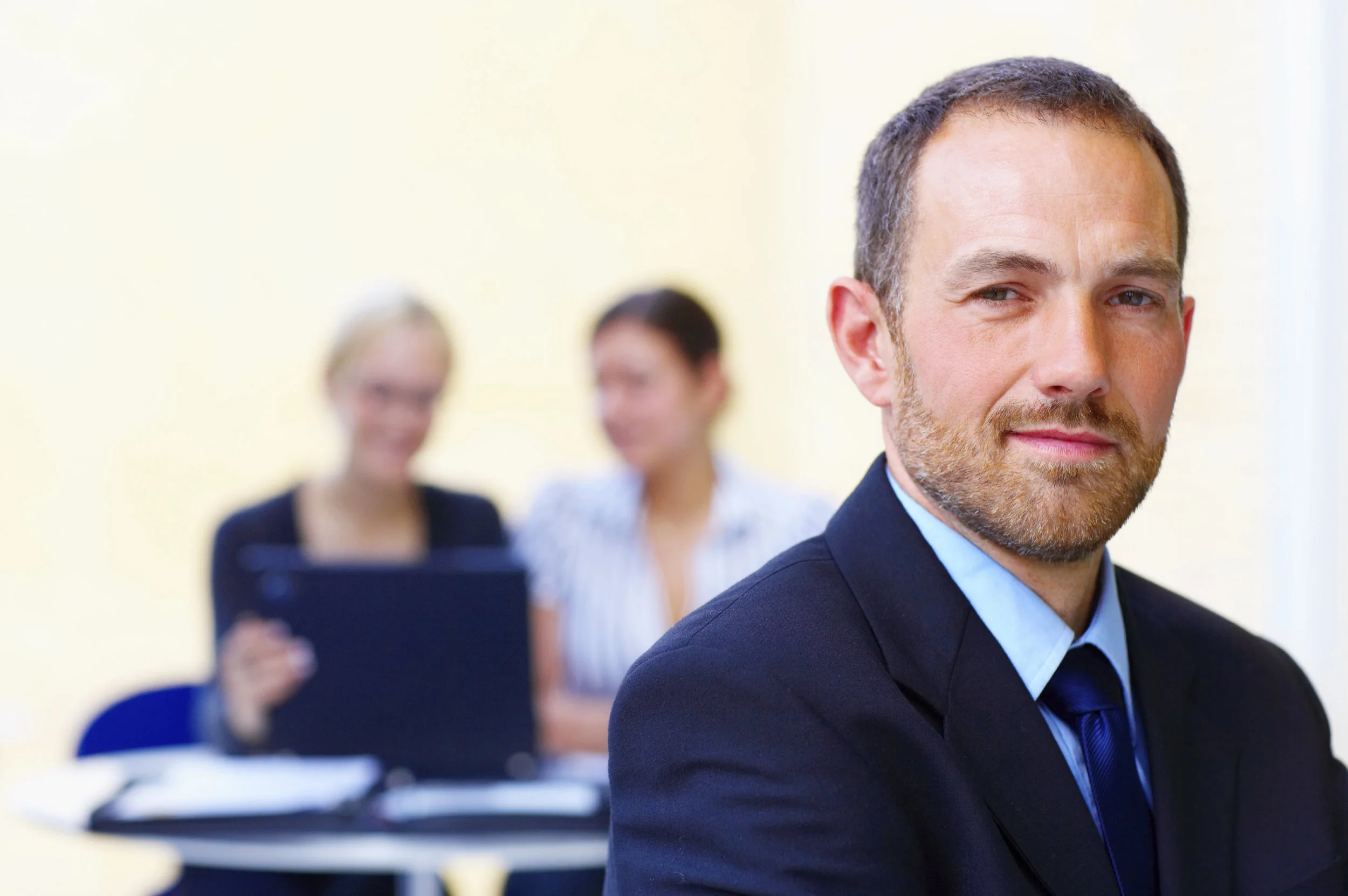 ist2_3485265-close-up-of-a-businessman-smiling.jpg